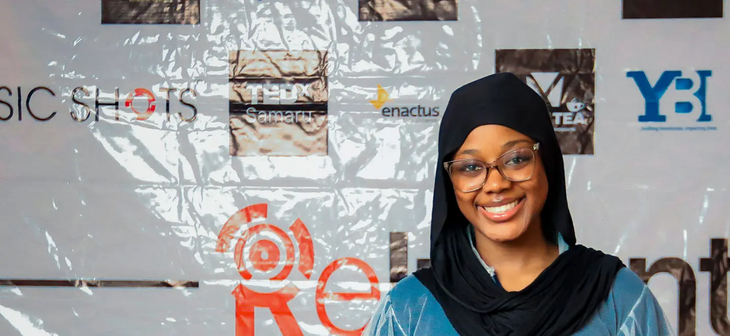 TEDx Samaru attendee at a recap wall